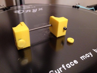 rostock-max-v2-tensioner-02.jpg (345.4 KiB) Viewed 20663 times Bottom view of belt tensioners - buttons would be placed on the bottom of the adjustment screws to keep from marring the melamine panel and hopefully keep the bracket upright.