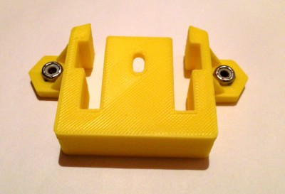 Top bracket with nuts installed. Notice the slots inside each side wall. This is to allow the bearing brackets to move up and down, but limit rotation.