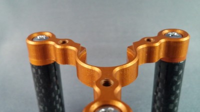 The notch allows for a 16mm wide passage. The recess holds the mounting flange of both an E3d V6 or a J head style hotend.