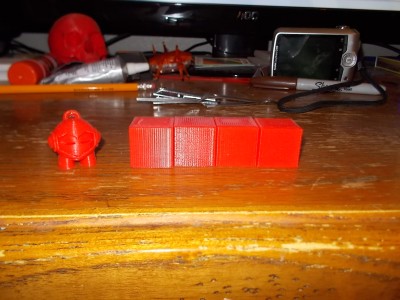 First few test prints after I got my Layer fan printed.  Just 20mm test cubes done in .1-.4 layer height and that silly Marvin guy.